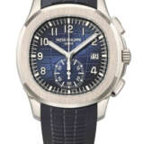 PATEK PHILIPPE. A COVETED 18K WHITE GOLD AUTOMATIC FLYBACK CHRONOGRAPH WRISTWATCH WITH DATE - photo 1