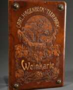 Wine & Spirits. Original &quot;Carl Hagenbeck's Tierpark Weinkarte&quot; mit Eisbären und Weinlaub Dekorationen sowie Messing Nägeln in den Ecken, um 1910, punziertes, partiell im Relief gestaltetes und vergoldetes Leder, unten Herstell…