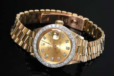 Gelbgold 750 Rolex &quot;Oyster Perpetual Lady Datejust&quot; mit Brillantlünette (zus. ca. 0.99ct/VVS/W), goldfarbenem Zifferblatt, Leucht-Punktindizies mit Achtkantdiamanten, Automatikwerk, Faltschließe, Datumsfenster…