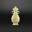 AN ARCHAISTIC YELLOW AND RUSSET JADE ‘DRAGON’ VASE AND COVER - Now at the auction