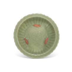 A LONGQUAN CELADON BISCUIT RESERVED AND CARVED BARBED-RIM CHARGER