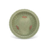 A LONGQUAN CELADON BISCUIT RESERVED AND CARVED BARBED-RIM CHARGER - фото 1