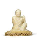 Speckstein. A FINELY CARVED SOAPSTONE FIGURE OF A LUOHAN