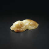 A YELLOW AND RUSSET JADE RECUMBENT HOUND - photo 1