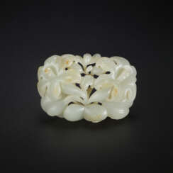 A RARE RETICULATED WHITE JADE ‘DAYLILY’ PLAQUE