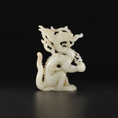 A WHITE JADE OPENWORK FIGURE OF A DRAGON - фото 1