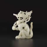 A WHITE JADE OPENWORK FIGURE OF A DRAGON - photo 2