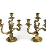 Подсвечники. Pair of gilded bronze rocaille candelabra.