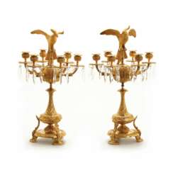 Pair of candelabra with figures of birds of paradise.