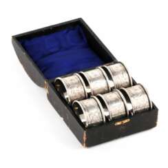 Six English silver napkin rings, in an original case.