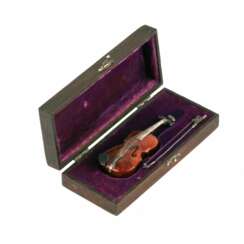 Miniature violin model in its own case.