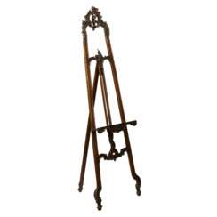 Carved, wooden easel of the turn of the 19th-20th centuries in neo-rococo style.