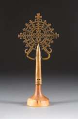 A SMALL COPTIC BRASS PROCESSIONAL FINIAL