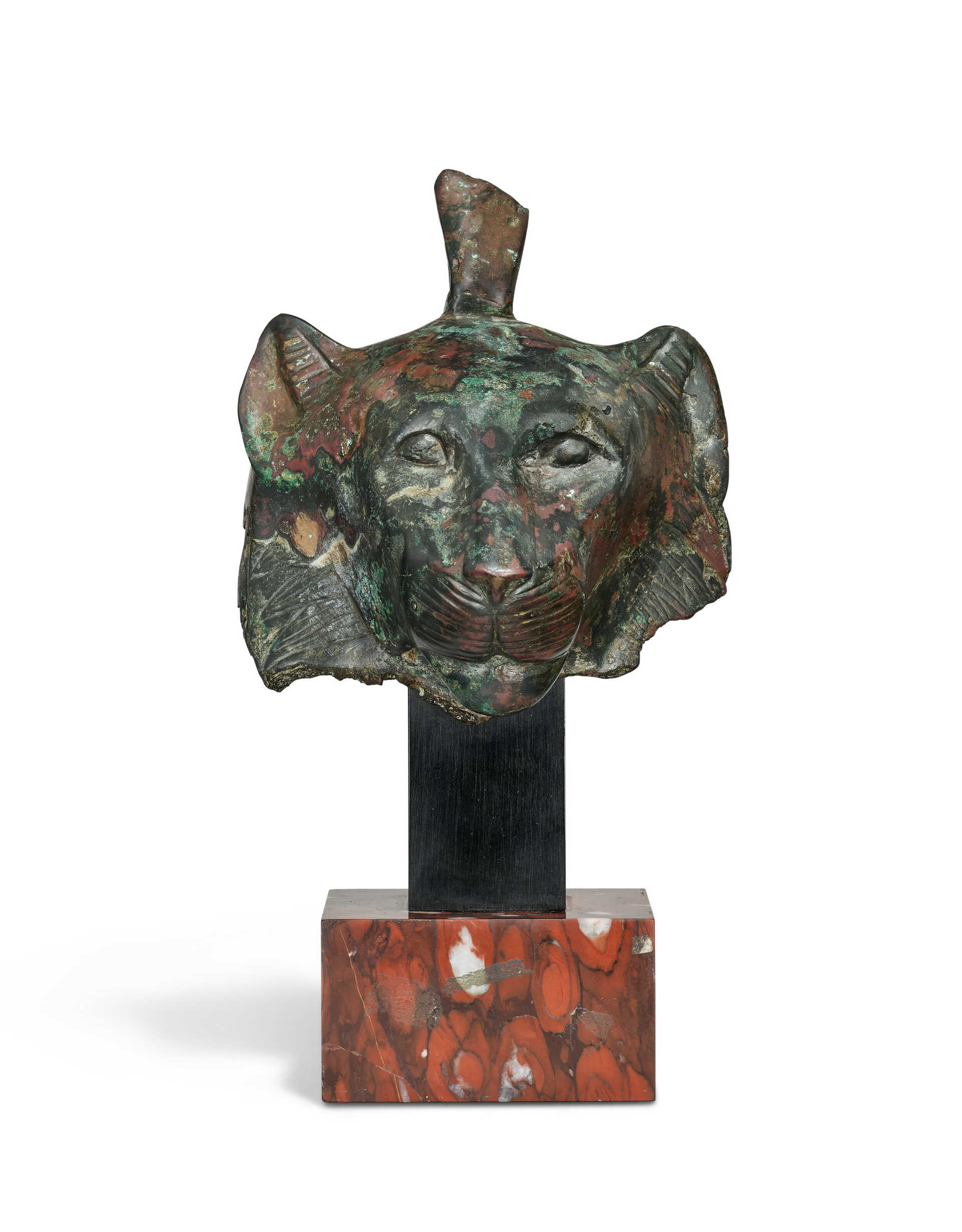 AN EGYPTIAN BRONZE HEAD OF THE GODDESS WADJET