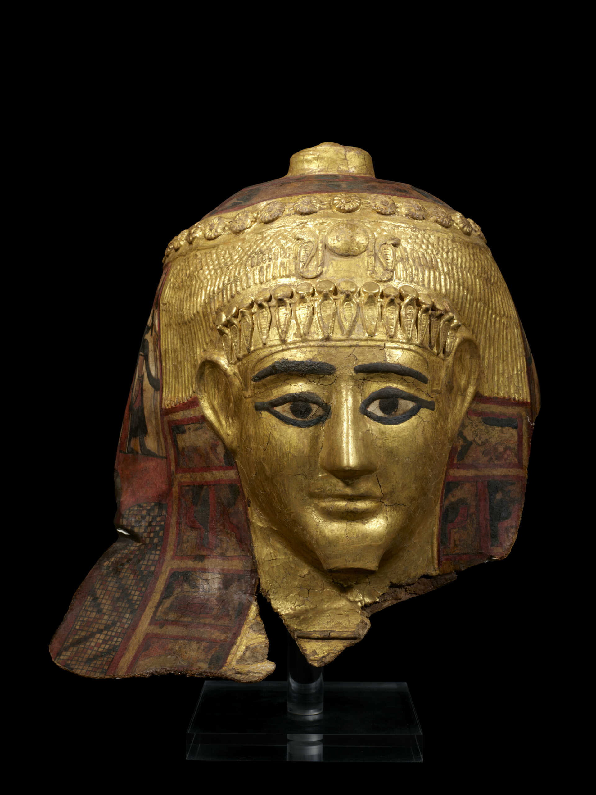 AN EGYPTIAN GILT CARTONNAGE MUMMY MASK