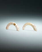 Dynastie Zhou (1100-256 av. J.-C.). TWO JADE SILK-WORM FORM PENDANTS