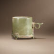 A BRONZE-INSET JADE HANDLED CUP - Maintenant aux enchères