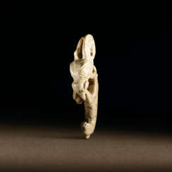 A VERY RARE JADE CARVING OF AN EMBRYONIC MYTHICAL ANIMAL