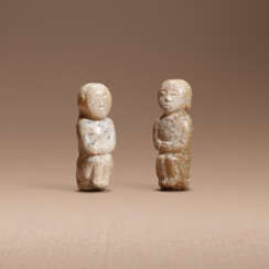 A PAIR OF SMALL JADE FIGURES