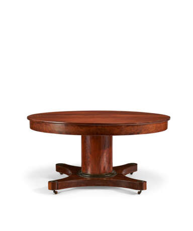 A CENTRAL EUROPEAN MAHOGANY AND PARCEL-EBONIZED CIRCULAR EXTENSION DINING TABLE - photo 6