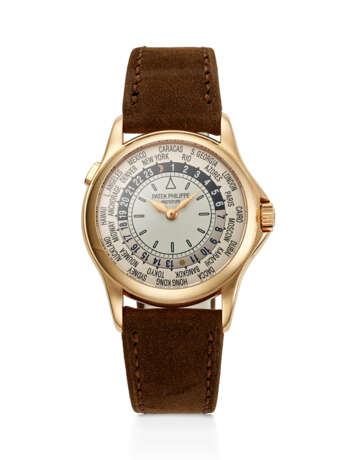 PATEK PHILIPPE, RARE PINK GOLD WORLD TIME WRISTWATCH, WITH PROTOTYPE DIAL, REF. 5110R - фото 1