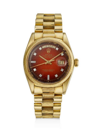 ROLEX, YELLOW GOLD AND DIAMOND-SET 'DAY-DATE', WITH RED VIGNETTE DIAL, REF. 1807 - photo 1