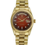 ROLEX, YELLOW GOLD AND DIAMOND-SET 'DAY-DATE', WITH RED VIGNETTE DIAL, REF. 1807 - photo 1