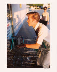 William Eggleston.Untitled (Supermarket Boy with Carts)