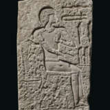 AN EGYPTIAN LIMESTONE RELIEF FRAGMENT - фото 1