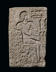 AN EGYPTIAN LIMESTONE RELIEF FRAGMENT