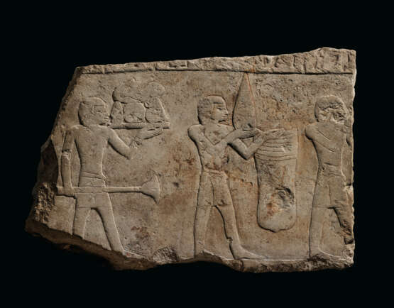 AN EGYPTIAN LIMESTONE RELIEF FRAGMENT - photo 1