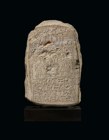 AN EGYPTIAN LIMESTONE ROUND-TOPPED STELE - photo 1