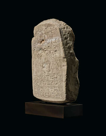 AN EGYPTIAN LIMESTONE ROUND-TOPPED STELE - photo 2