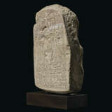 AN EGYPTIAN LIMESTONE ROUND-TOPPED STELE - photo 2