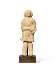 A PARTHIAN TERRACOTTA MUSICIAN