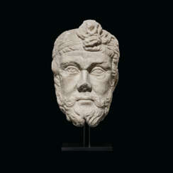 A ROMAN MARBLE HEAD OF A BEARDED BARBARIAN