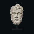 A ROMAN MARBLE HEAD OF A BEARDED BARBARIAN - Jetzt bei der Auktion