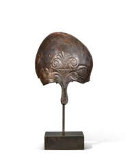 A GREEK BRONZE CORINTHIAN HELMET FRAGMENT