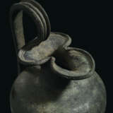 A ROMAN BRONZE TREFOIL OINOCHOE - photo 5