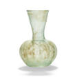 A ROMAN GREEN GLASS FLASK - Now at the auction