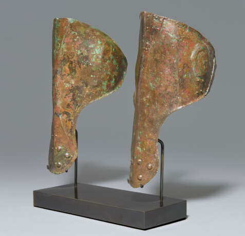 A PAIR OF ITALIC BRONZE ANKLE-GUARDS - photo 2