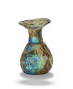 Carafes, Decanters, Jugs, Pitchers (Household items, Tableware and Serveware, Drinkware). A ROMAN PALE GREEN MOULD-BLOWN GLASS SPRINKLER FLASK