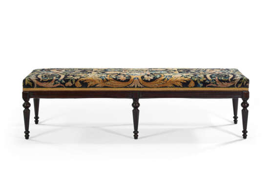 A LOUIS XVI STYLE EBONIZED WOOD BANQUETTE UPHOLSTERED IN A SAVONNERIE CARPET FRAGMENT - photo 1