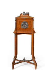 A NAPOLEON III SILVERED-BRONZE-MOUNTED OAK MEDAILLER-ON-STAND