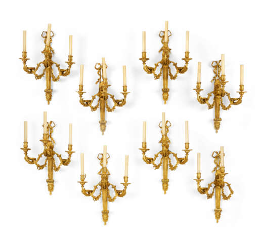 A SET OF EIGHT FRENCH ORMOLU THREE-BRANCH WALL-LIGHTS - photo 1