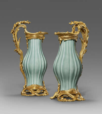 A PAIR OF LOUIS XV ORMOLU-MOUNTED CHINESE CELADON-GLAZED PORCELAIN EWERS - photo 1