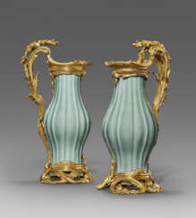 A PAIR OF LOUIS XV ORMOLU-MOUNTED CHINESE CELADON-GLAZED PORCELAIN EWERS