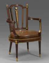 A LATE LOUIS XVI ORMOLU-MOUNTED MAHOGANY FAUTEUIL DE BUREAU