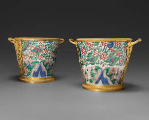 A PAIR OF REGENCE ORMOLU-MOUNTED CHINESE WUCAI PORCELAIN CACHE-POTS