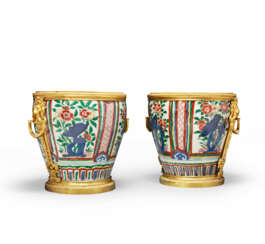 A PAIR OF RESTAURATION ORMOLU-MOUNTED CHINESE WUCAI PORCELAIN CACHE-POTS